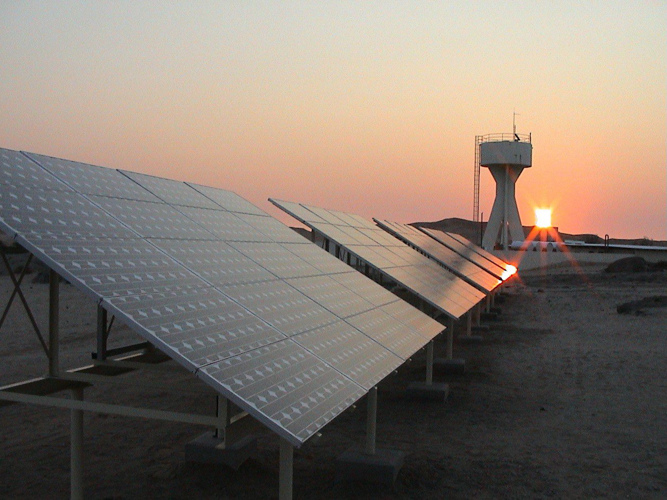 Solar array at sunset in a desert environment